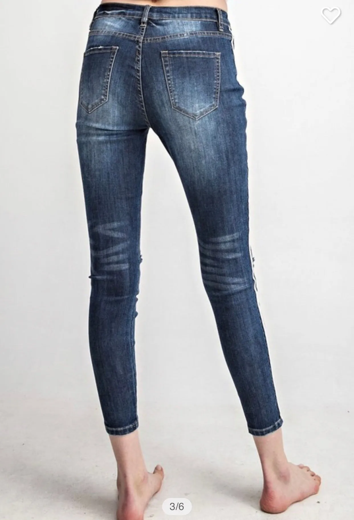 Distressed Skinny jeans with white stripe side detail